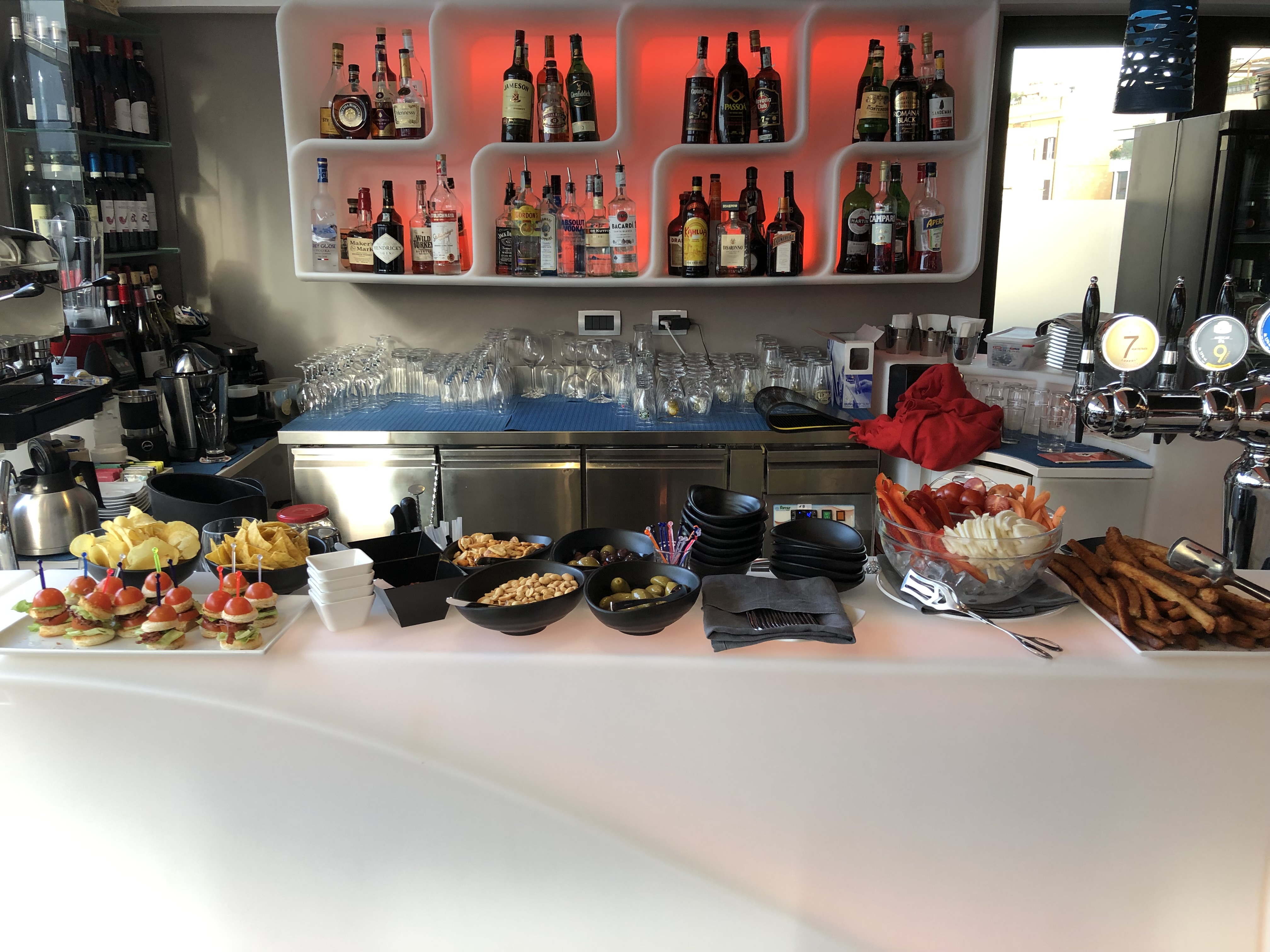 Italian bar at golden hour with Spritz glasses on the counter