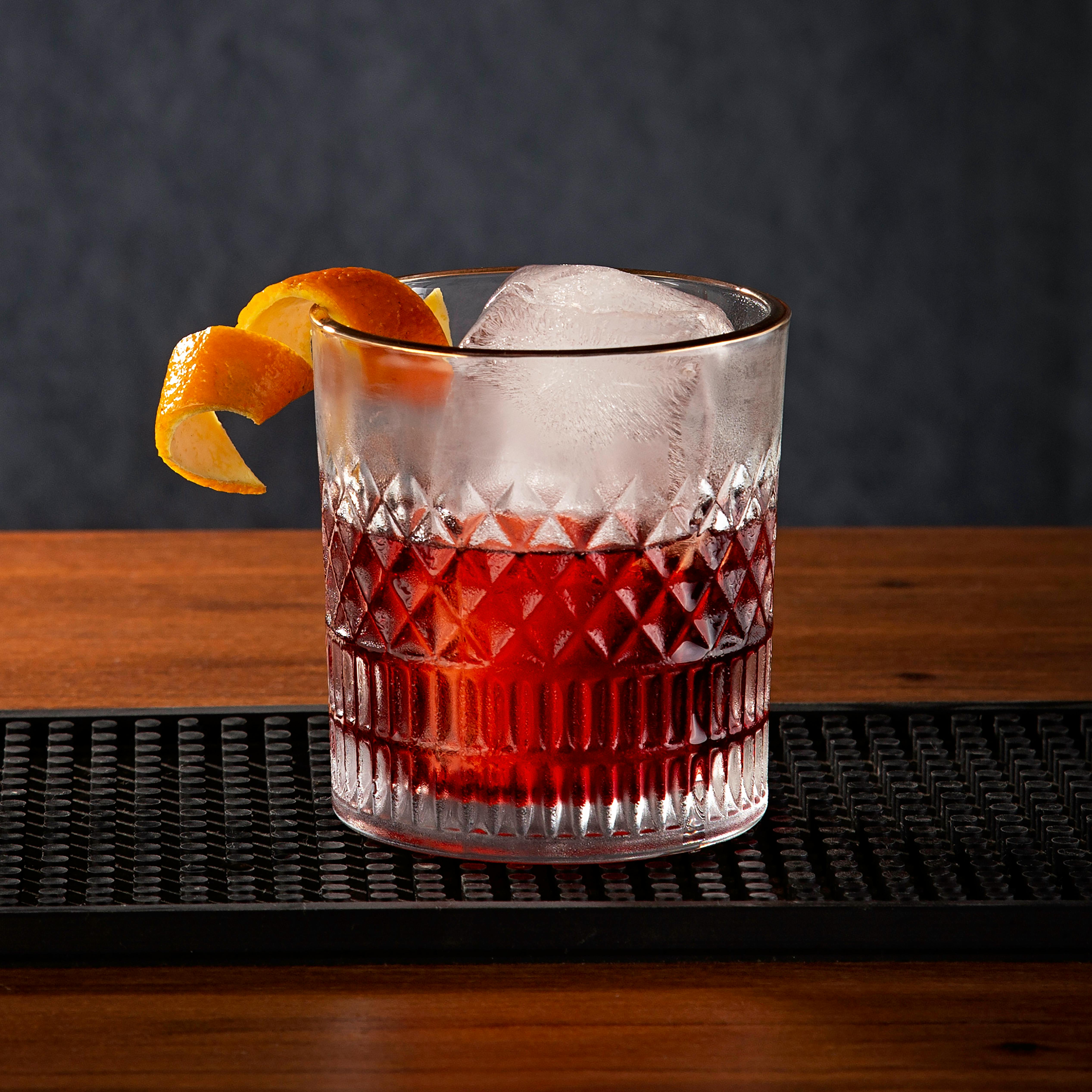 Negroni in a crystal rocks glass with orange peel
